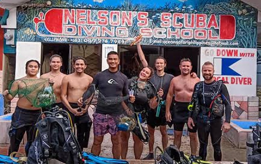 Nelson's Scuba Diving School shopfront with the crew and divers